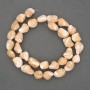 Beads on a thread, natural beige. Mother-of-pearl, faceted, diameter 10-12 x 8-10 mm, length 40 cm ± on a beading wire
