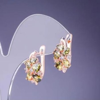 Earrings with green crystals 19×10 mm gold-toned metal