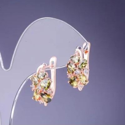 Earrings with green crystals 19×10 mm gold-toned metal