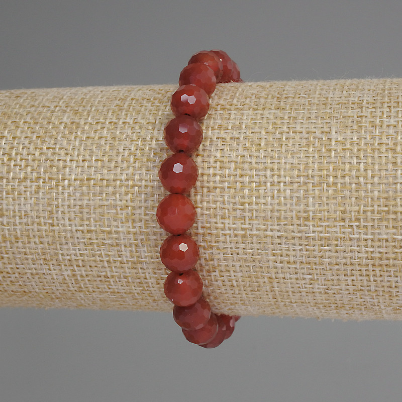 Carnelian bracelet with a faceted bead, 8mm diameter ±, 18mm length ±, stretch