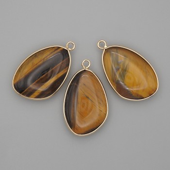 Pendant Tiger's Eye in a gold-tone metal setting 21x35 mm+