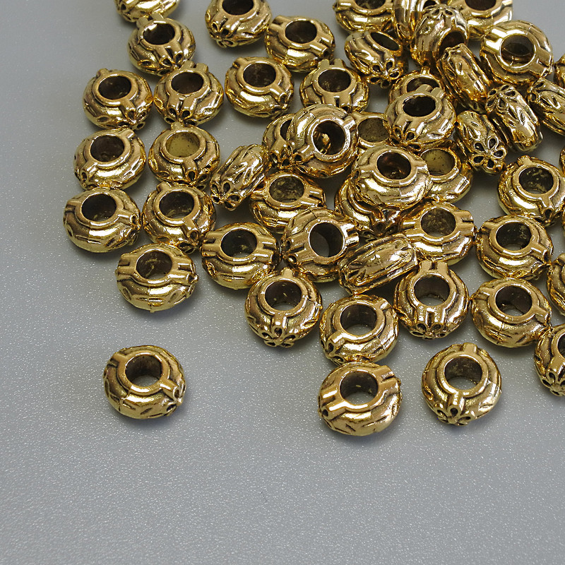 Gold-tone bead insert finding, 6×3 mm diameter with approximately 3 mm hole, packaging 20 g (~56 pcs)