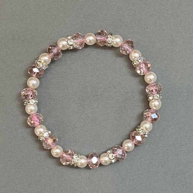 Bracelet with Czech crystal rondelles, diameter 8x6 mm, imitation pearl bead 6 mm, with metal inserts, elastic length about 18 mm