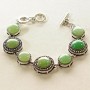 Clearance. Jade bracelet in bezel 'Dot Cross' with round stones, larger and smaller, 7 stones, 19 and 15 mm, length 18-21 cm