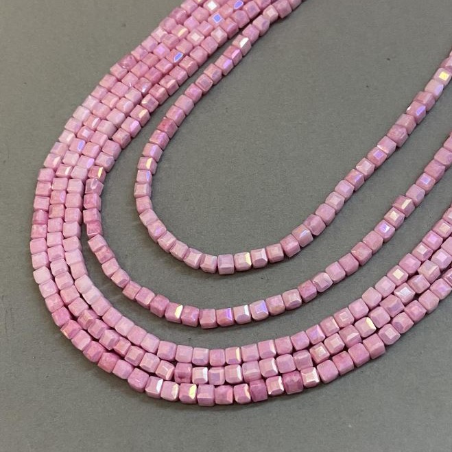 Pink Czech Crystal Beads with a 'Gasoline' finish on thread, faceted cube, diameter 4x4 mm + -, length 38 cm +