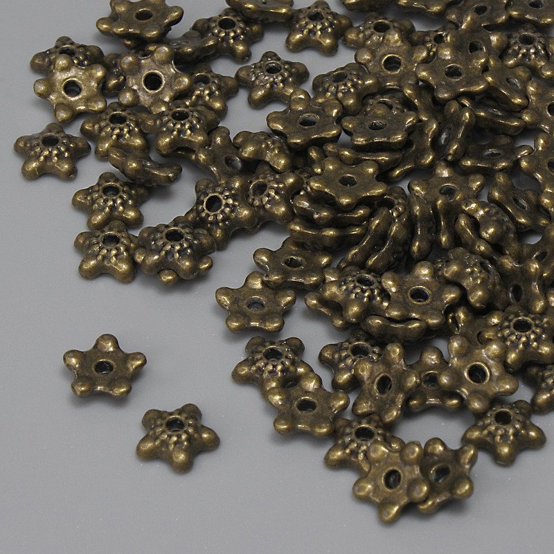 Bead cap findings in antique bronze color, diameter 6×1 mm, hole diameter about 1.1 mm, packaging 20 g (~90 pcs)