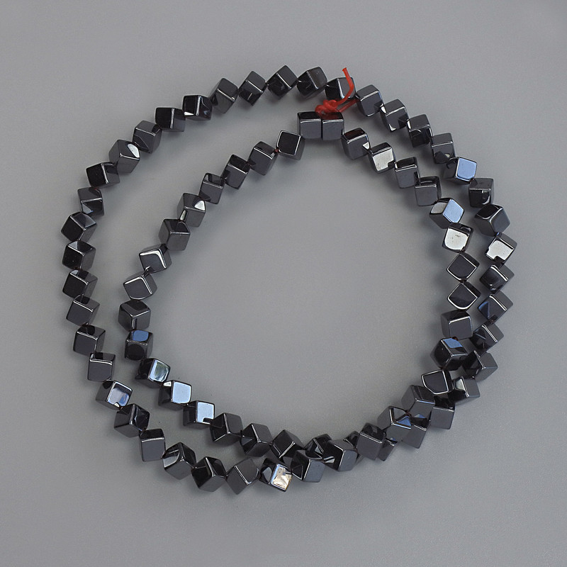 Hematite cube beads with through hole 4x4 mm ± on beading thread, length 40 cm+