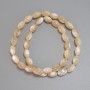 Beige mother-of-pearl beads, grain-shaped, diameter 10-11×6 mm, 5 mm +/-, length 40 cm +/- on thread