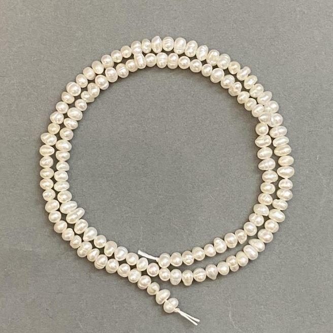 Natural freshwater pearl beads 3x4 mm, approx. 35 cm long on a thread