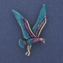 Bird Brooch with blue, violet, and silver enamel on golden metal 38x56 mm +