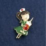Brooch 'Nurse' enamel green and red, gold-tone metal 44×25mm