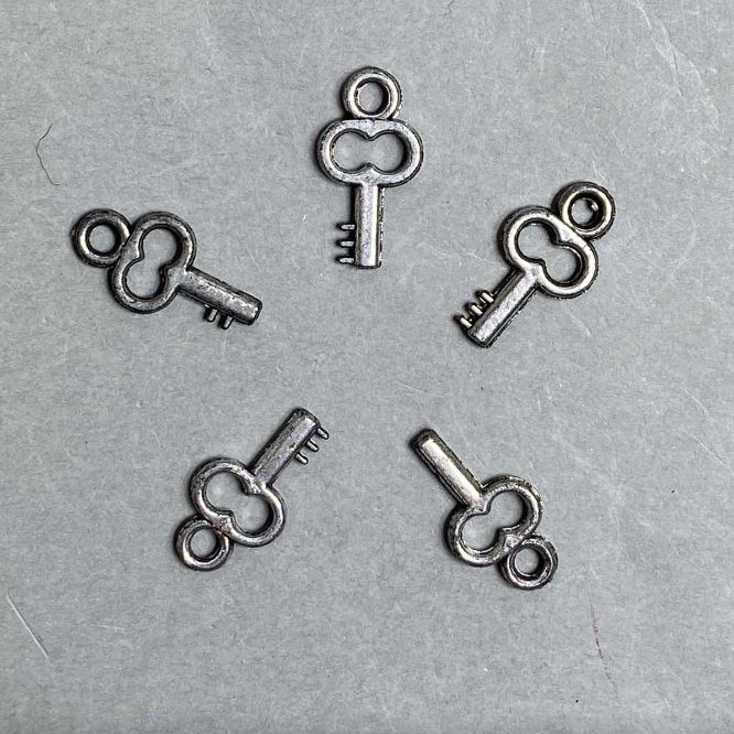 CLEARANCE! Key-shaped pendant hardware, plastic, dark silver color, dimensions 20x11x3 mm ±, hole diameter 3 mm ±, packaging 0.5 kg
