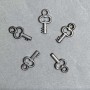 CLEARANCE! Key-shaped pendant hardware, plastic, dark silver color, dimensions 20x11x3 mm ±, hole diameter 3 mm ±, packaging 0.5 kg