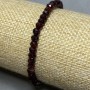 Garnet bracelet with a faceted bead, 5 mm diameter ±, rondelle 5x3 mm, 18 cm stretch