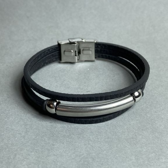 Black bracelet with metal inserts and a clasp, length 21 cm+