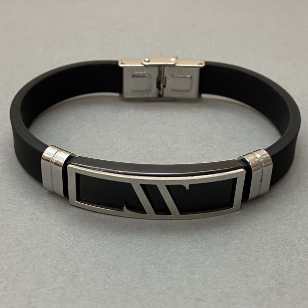 Black bracelet with a clasp and metal inserts, length 21 cm+