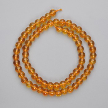 Citrine beads, pressed smooth spheres, 6mm diameter, on a 37 cm strand