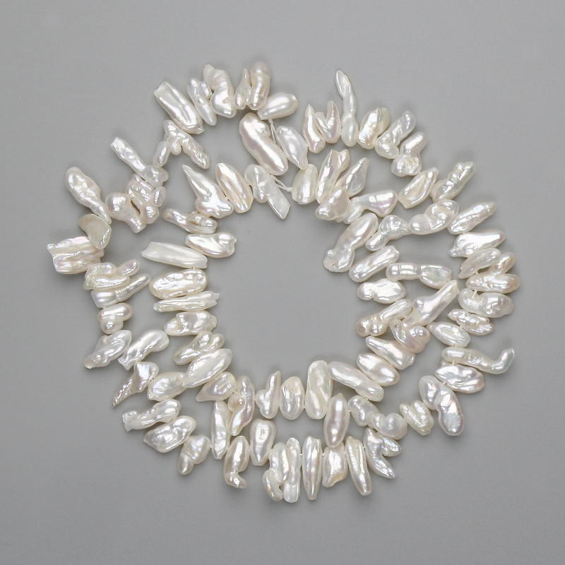 Baroque pearls with petrol tint on a thread, 7-14×3-7 mm, length approx. 38 cm ±