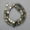 Pyrite beads, natural stone, unpolished, tumbled, diameter 4–12×7–11 mm, length 38 cm on thread