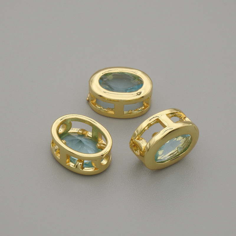 Blue crystal bead insert in gold-tone metal, oval, 9×7 mm, hole diameter 1.3 mm, per piece