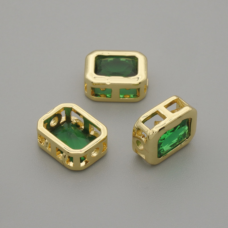 Bead insert with green crystal in gold-tone metal, 9x7 mm diameter ±, hole diameter 1.3 mm ±, per piece