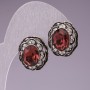 Stud earrings with pink oval crystals and a delicate filigree setting encrusted with rhinestones, 17 mm