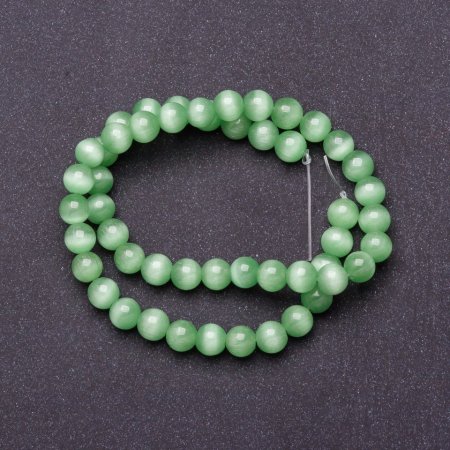 Natural stone beads on thread, cat's-eye light green, 8 mm diameter, 37 cm length