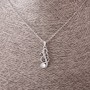 Pendant on a chain "Treble Clef", diameter 2.5 cm, length 55 cm, metal color "silver"