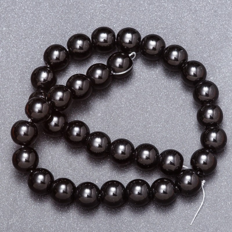 Black agate beads (pressed) on a thread, diameter 12 mm, length 37 cm