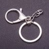 Price per pack / 10 pcs. Keychain base with two attachments: carabiner + ring, diameter 3 cm, length 5 cm
