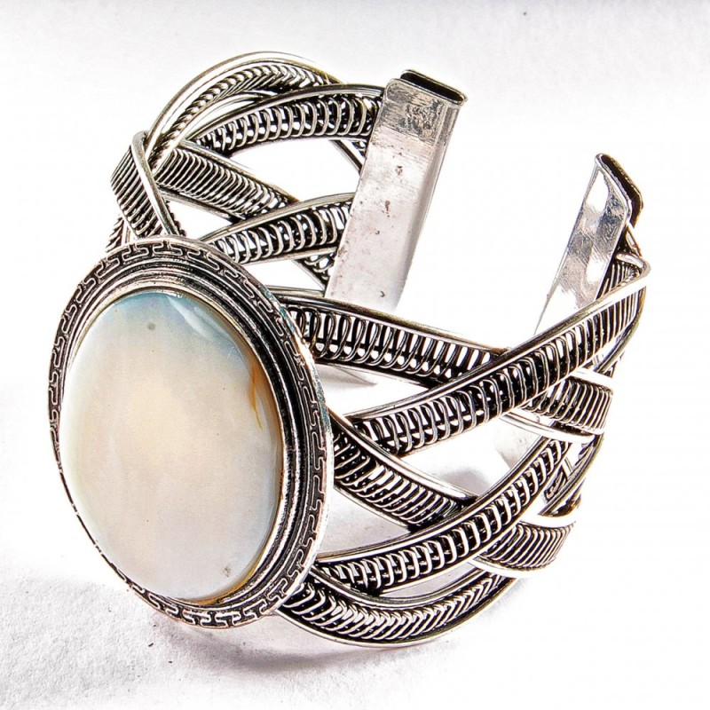 Wide mother-of-pearl bracelet in a metal bezel setting with Greek pattern, small oval