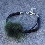 Faux leather bracelet with green tint and natural fur