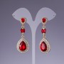 Earrings with red crystals, 6 cm long, yellow metal
