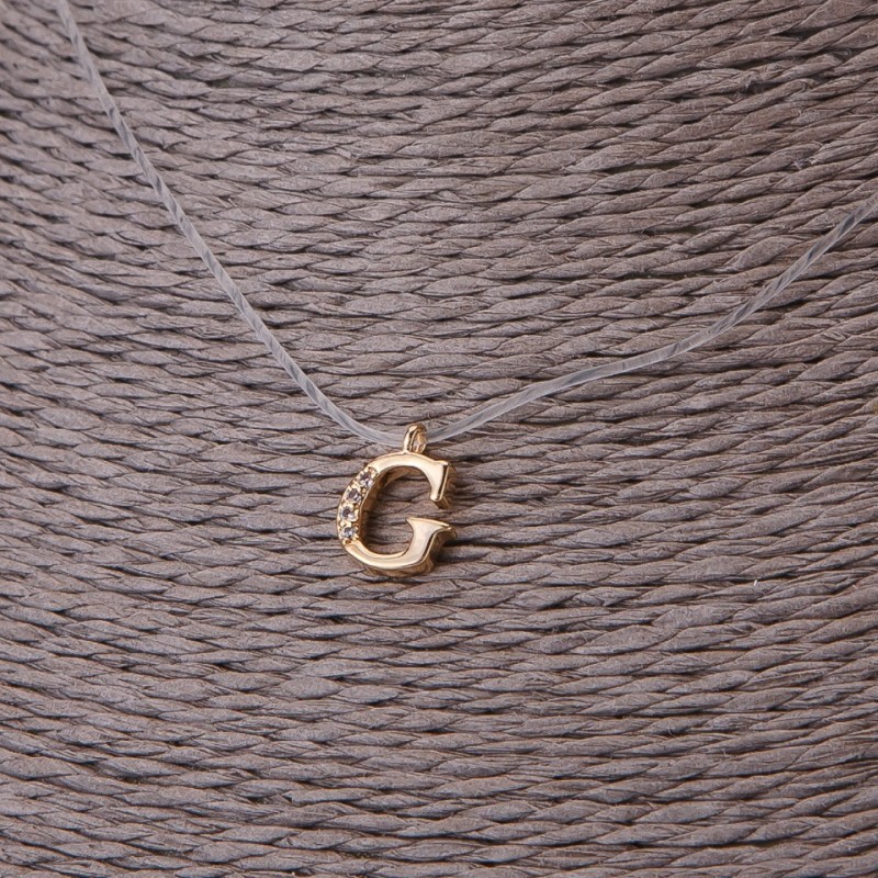 Pendant, 9 mm diameter on invisible silicone cord, length 39–44 cm