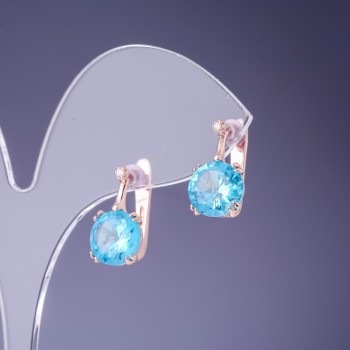 Earrings with blue crystals 16x9 mm in golden metal