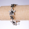 Evening bracelet 'Lilies' with black crystals, color 'antique silver', width 25mm, length 19-25cm