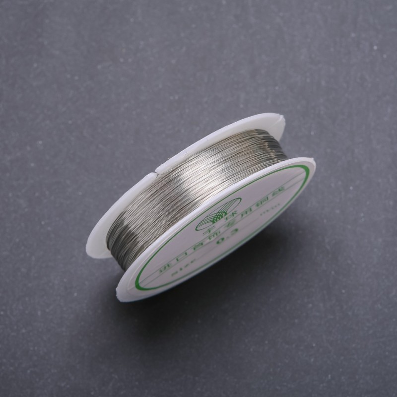 Silver-colored jewelry wire, 0.3 mm diameter, on a spool, 14 m long