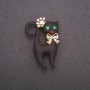 Brooch 'Cat in a Crown' with black matte enamel, yellow metal, 28×42 mm