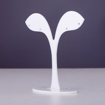 White plastic jewelry stand, 7 cm tall, 7 cm wide