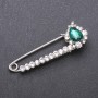 Discount! Brooch pin with green glass crystals 64×22 mm white metal