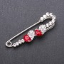 Brooch pin with red glass crystals, 67×18 mm, white metal