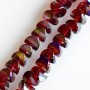 Crystal beads in Swarovski style, dark red ruby with blue coating, 6x4 mm diameter, 50 cm cord
