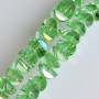 Crystal beads in Swarovski style light green with a Light Gasoline coating, diameter 6x4 mm, thread length 50 cm