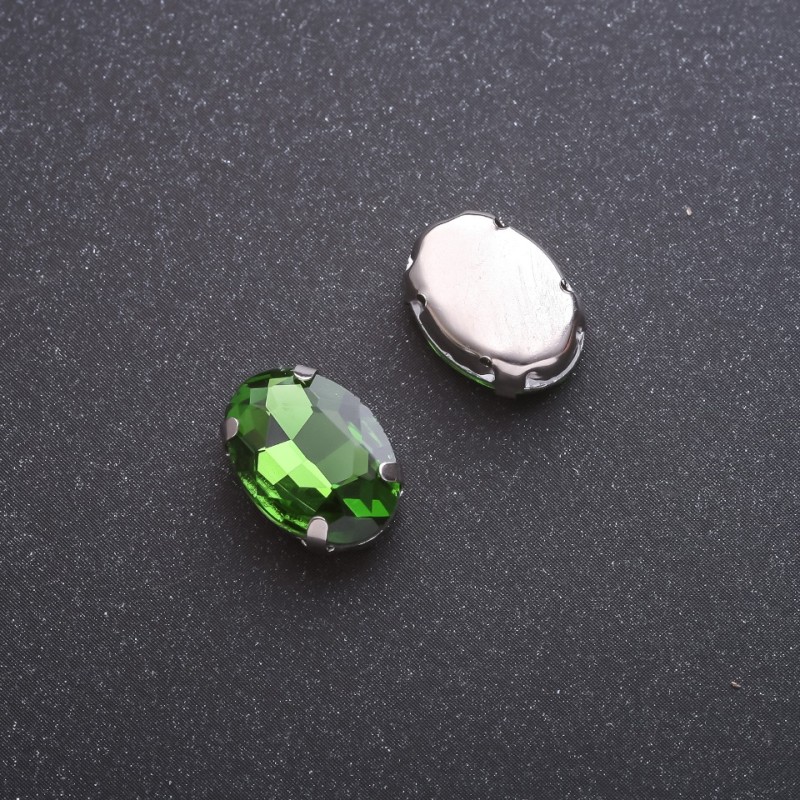 Price per pack: 10 pcs. Green oval sew-on crystal in prong setting, 10×14 mm