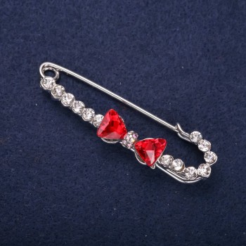 Discount! Bow brooch pin with white crystals and red stones, 64x18mm, silver-colored metal