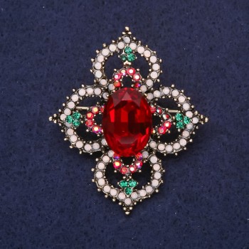 Brooch 'Order of Beauty' with a stone and rhinestones, color red, white, and green, 49x42 mm, yellow metal