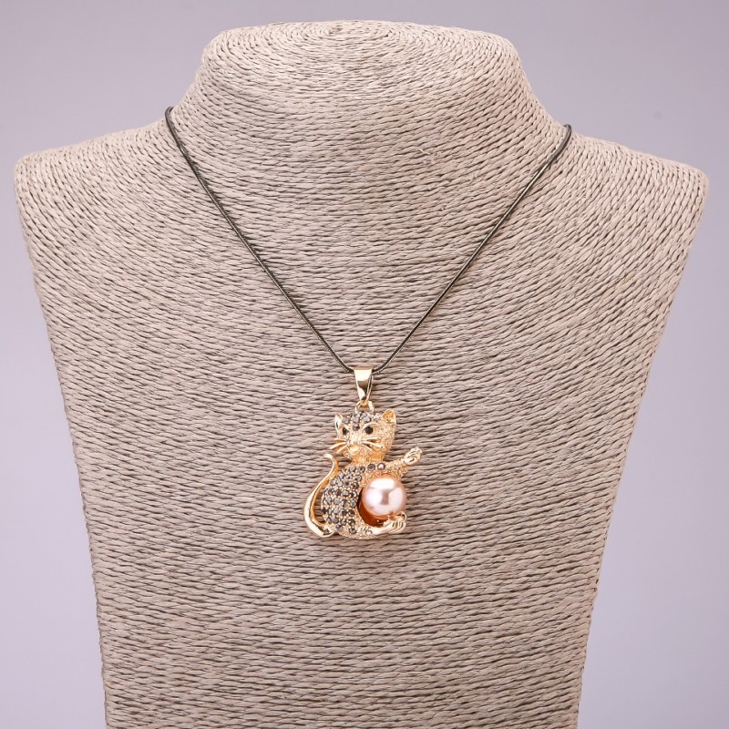 Pendant 'Kitty' with black crystals on a long chain of metal 'black gold', diameter 30x39 mm, length 70 cm