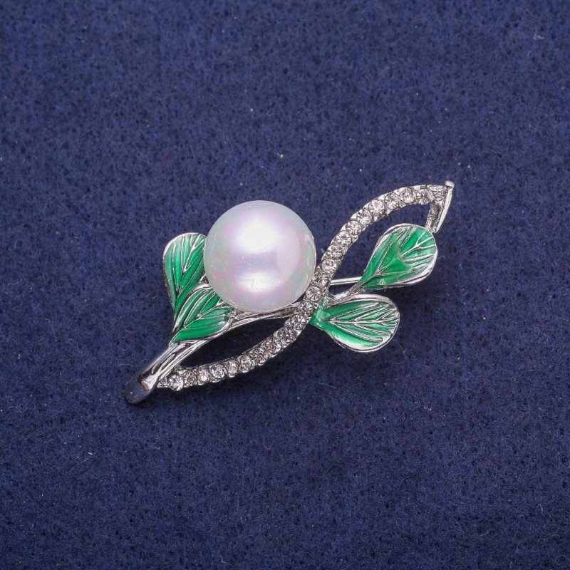 Brooch 'Twig' with enamel, rhinestones and pearl, silver-toned metal 27x48mm