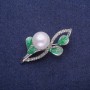 Brooch 'Twig' with enamel, rhinestones and pearl, silver-toned metal 27x48mm