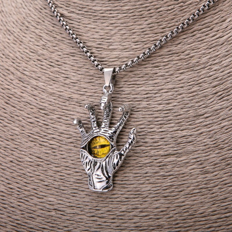 Pendant Skeleton Hand with Yellow Eye, 30x55 mm on chain, length 65 cm, silver metal color